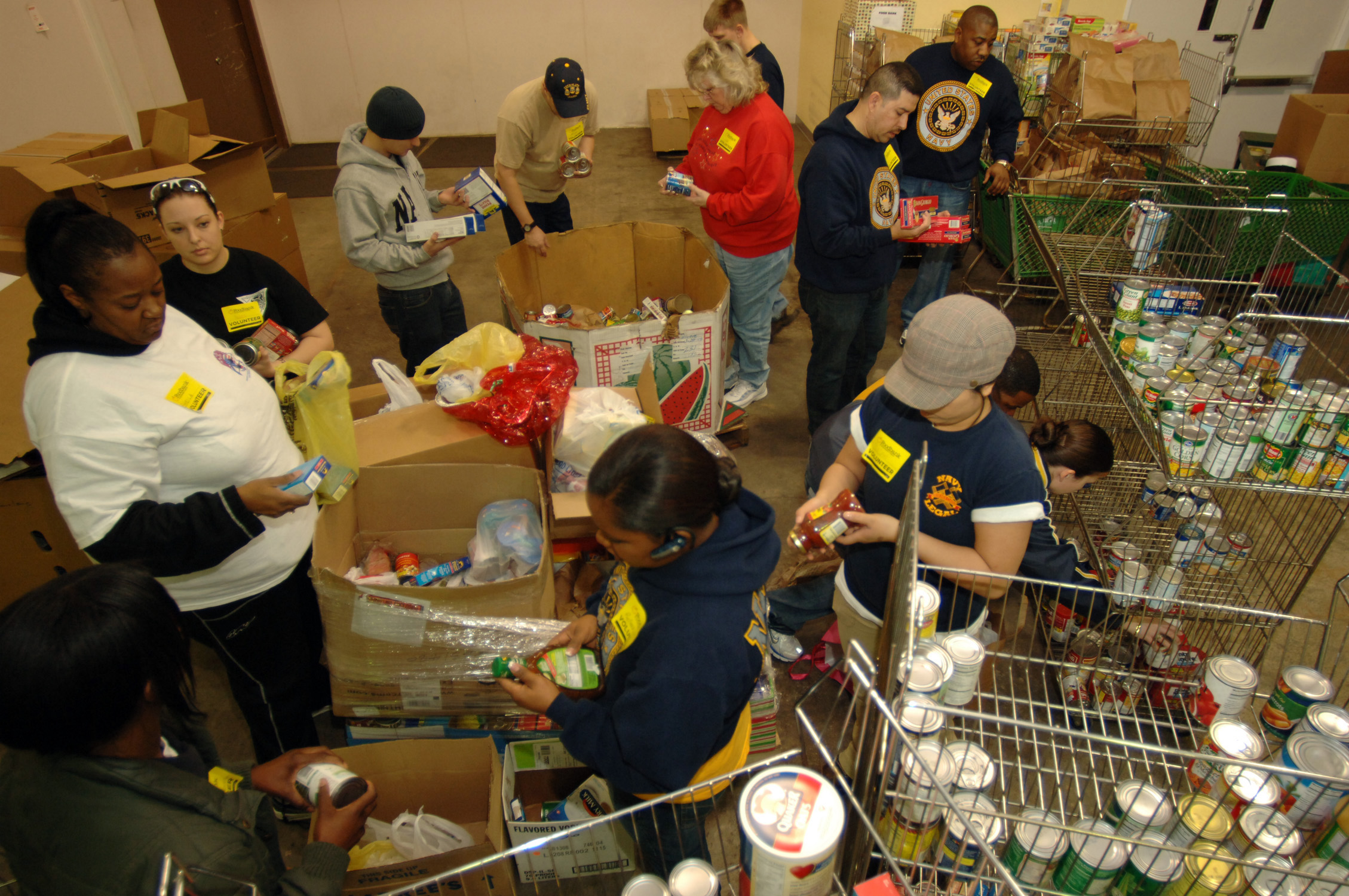 Community volunteers sorting donated food at the Foodbank of Southeastern Virginia in Norfolk